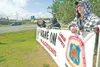 ROBERT DeBERRY/Frontiersman Three United Brotherhood of
Carpenters and Joiners of America union members stand with a banner
protesting Walgreens along the Parks Highway Friday afternoon.