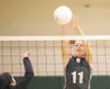 ROBERT DeBERRY/Frontiersman Colony junior Tess Forstner blocks a
Kenai hit during Saturday’s match at Colony High School.