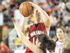 ROBERT DeBERRY/Frontiersman Carlee Naczi shoots for two points
during the Warriors' game against the Juneau-Douglas Crimson Bears
at the 4A state basketball championships in Anchorage.
