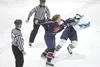 ROBERT DeBERRY/Frontiersman Santa Fe defenseman Thomas Kleidon,
left, reaches back to throw a punch after pulling the jersey over
the head of Alaska blueliner Clay Kasten during a fight in Fr