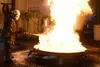 John Farley, director of fire test operations at the Naval Research Laboratory, tests the effectiveness of aqueous film-forming foam by spraying it on a gasoline fire. The test took place at 