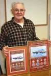 CASEY RESSLER/Frontiersman Wayne Bouwens shows off the prints
which are being sold to commemorate the 70th anniversary of the
Matanuska Colony Project.