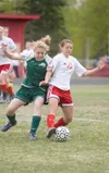 Wasilla sophomore Nicole Vanni takes control of the ball form
Colony's Ali Baker during Monday's game at Wasilla High School.
(ROBERT DeBERRY/Frontiersman)