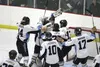A group of Chugiak Mustangs swarm Chugiak goalie Jack Walters after Walters used a 31-save shutout to lead Chugiak to a 3-0 win over South Anchorage in the ASAA FIrst National Cup state title