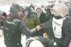 ROBERT DeBERRY/Frontiersman Two-time defending Iditarod Trail
Sled Dog Race champion Lance Mackey, left, shakes the hand of his
stepson, Cain Carter, prior to the start of the 2009 Junior
Idi