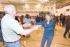 Rob Sterling and Patty Windel move their feet to the sounds of
the band during the Rally to Restore Sanity Saturday at Wasilla
Middle School. (ROBERT DeBERRY/Frontiersman