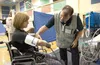 Celena Randolph plays the part of a disaster shelter patient as Mat-Su Regional Medical Center’s Charles Darnell checks her vital signs during a mock disaster as part of Alaska Shield 2012. F