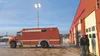 Houston Fire Department Chief Tom Hood, left, and firefighter Jerry Smith try out the lighting system on a new rescue truck in December. The rig was acquired from Joint Base Elmendorf-Richard