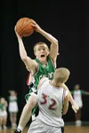 Colony Knight John Palmer drives to the basket during the first
half of Friday's semi-final game at the state basketball
championship tournament in Anchorage. (ROBERT
DeBERRY/Frontiersman