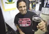 Denali Brewing Co. General Manager Sassan Mossanen holds up a pint of ‘Slow Down Brown’ at the Mighty Matanuska Brewfest Saturday at Raven Hall on the Alaska State Fairgrounds. ROBERT DeBERRY