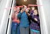 Heather Welcome, flanked by daughters Hailey, 11, and Madison, 8, and contractor Tim Ensminger cut the ribbon on the Welcome family’s Habitat for Humanity home in Palmer Saturday afternoon. R