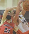 Houston's Hunter Jefferson and Homer's Clayton Beachy battle for the rebound Saturday, March 13, 2021, in the third-place game of the Southcentral Conference boys tournament at Kenai Central 
