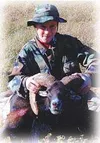 Eleven-year-old Casey Marre of Wasilla poses with the muflon he
shot during a hunting trip on a Texas game ranch this fall. Photo
courtesy the Marre family.