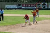 Wasilla's AJ Camacho tries to get back to first before Palmer's Kaden Ketchum can make a throw during a Road Warriors 4-2 win over the Pioneers July 4 Tim Rockey/Frontiersman