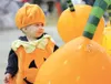 ROBERT DeBERRY/Frontiersman Azlyn Ure, 1, stops to observe what
looks like a relative from the local pumpkin patch Wednesday at
Halloween Hollow at the Alaska State Fairgrounds in Palmer. The