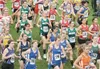 ROBERT DeBERRY/Frontiersman Runners in the 4A Palmer Cross
Country Invitational get into stride as they head off the field and
onto the trail at Palmer High School on Saturday afternoon. More