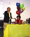CASEY RESSLER/Frontiersman Valley Hospital CEO Norman Stephens
congratulates Noreene James, who was named Alaska's Outstanding
Older Worker for 2004.