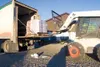 The first delivery of dog food and hay from Alaska Mill and Feed
is unloaded at the Mat-Su Borough Animal Care Facility. The initial
delivery contained 160 bags of dog food. Alaska Mill and F