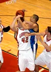 Wasilla center Luke Schafer and Palmer forward Stanley Ratcliff
fight for a rebound during Palmer's 50-46 win at Wasilla High
School on Tuesday. The Moose improved to 6-0 in Region III play
w