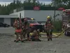 An exhausted firefighter catches his breath.jpg
