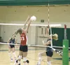 Lindsey Shogren leaps for a block against the Colony Knights
during her senior season. Photo by JEREMIAH BARTZ/ Frontiersman