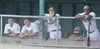 A group of Mat-Su Miners watch the action from the home dugout at Hermon Brothers Field during the team's home opener Sunday, June 12, in Palmer. JEREMIAH BARTZ/Frontiersman