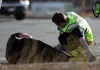 Medical personnel attend to a man who was struck by a car on Saturday at the intersection of the Palmer-Wasilla Highway and Seward Meridian Parkway in Wasilla. The man suffered minor injuries