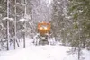 MATT TUNSETH/Frontiersman A Sno-cat makes a trail through black
spruce last week in the woods near Trapper Creek. The Alaska Moose
Federation recently began a project to use the large groomin