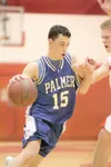 ROBERT DeBERRY/Frontiersman Palmer guard T.J. Fullmer drives the
ball around Wasilla forward Matthew Stearman during Palmer’s final
game of the regular season. Despite a 2-8 regular season re