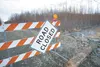 A ‘road closed’ sign blocks the Maud Road extension in the Butte Thursday afternoon. The Mat-Su Borough Public Works Department used gravel and riprap to temporarily repair a section that was