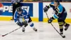 Kelly Gillin/Wenatchee World Jake Parenteau, right, of the
Alaska Avalanche, tries to pass around Wenatchee Wild forward
Michael Voran. The Wild won Saturday's game, outscoring the Avs
8-2. W