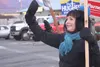 Incumbent Republican Shelley Hughes waves to traffic at the intersection of Palmer-Wasilla Highway and Glenn Highway Tuesday afternoon. As of 11:30 p.m. Hughes had a commanding lead over her 