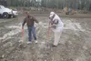 Clint Spencer with Alaska Pop Warner Football and Cheer (right) gets ready to ceremonially turn dirt with Wasilla Mayor Verne Rupright (left) Thursday at a project to build football fields — 