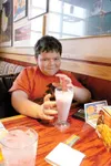Gabe wasn’t able to duck out of this shot. Nor was he able to
take his time with this blueberry smoothie. It was gone almost
before I knew it. (ANDREW WELLNER/Frontiersman)