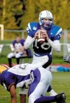 Palmer quarterback Charlie Bentti dodges a Lathrop defensive
lineman as he drops back to pass during Palmer's win over Lathrop
earlier this season. Phtoto by JEREMIAH BARTZ/ Frontiersman.