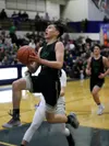 Colony’s Jeremiah Hersrud goes to the basket during a win over Palmer. Courtesy of Bruce Eggleston/matsusports.net