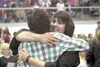 GREG JOHNSON/Frontiersman Houston High School class of 2010
graduate Marilena Staudenmaier, right, gets a hug from friend
Travis Patterson at Wednesday’s graduation ceremony at the Curtis
D. 