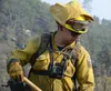 U.S. Army Spc. Daniel Rincon, a hand crew member with the Fresno-based Joint Task Force Rattlesnake Alpha team, hikes up the steep slope of Rumsey Canyon in order to aid the California Depart