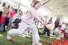 Louise Eaton, 5, scrambles to gather eggs during the Easter
event, attended by more than 1,500 people. ROBERT
DeBERRY/Frontiersman