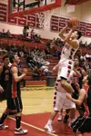 JEREMIAH BARTZ/Frontiersman Wasilla senior Cody Pfeifer scores
two of his game-high 36 points during a 63-56 win over the
Juneau-Douglas Crimson Bears in Doc Larson'€™s Roundball Classic at
W