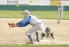 ROBERT DeBERRY/Frontiersman Colony Knight Josh Boring dives back
to first as Palmer first baseman Derek Eley attempts to make the
catch and tag.
