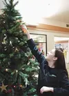 Chante Gamboa bought the first star for the Hospice of Mat-Su
Christmas tree Tuesday afternoon at the Cottonwood Creek Mall.
Photo by CASEY RESSLER/Fronteirsman.