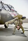 Staff Sgt. Brianna Pritchard, an Army National Guard UH-60 Black Hawk helicopter mechanic from Anchorage, Alaska, shows her Olympic breaking moves at Al Asad Air Base, Iraq, in May 2021. Prit