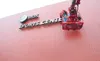 ROBERT DeBERRY/Frontiersman Super Sign employees work on the
AT&amp;T Sports Center sign Friday at the new $8 million sports
facility located along the Palmer-Wasilla Highway.