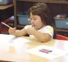 Jillian Stettenbenz erases a letter on her paper as she
practices writing in her first-grade class. Writing has proven a
challenging exam subject for some Mat-Su students, with between 20
and