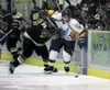 ROBERT DeBERRY/Frontiersman Alaska Avalanche forward Kyle
Pichler gets tangled up with Bismark Bobcat John Avino during
Saturday's game at the Curtis C. Menard II Memorial Ice Arena in
Wasill