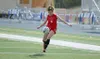 Houston senior Megan Adair moves the ball up the left side of the field during a scoreless tie against Palmer Thursday at Palmer High School. The Hawks used the tie to clinch the final berth 