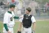 ROBERT DeBERRY/Frontiersman Mat-Su pitcher Andrew Berger, left,
pats Keith Christopher on the shoulder during the Miners’ 3-1 win
over the Anchorage Adult All-Stars on Friday at Hermon Brothe