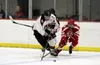 Houston senior Reed Humphreys works the puck down the ice during an overtime loss to Wasilla earlier this month. Houston is the top seed in the ASAA Division II state tournament, which starts