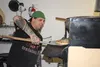 Knik Pizza owner Jonathan Ashburn takes a pizza out of the oven Oct. 7 at the pick-up and delivery shop off Yenlo Street in Wasilla. STEVEN MERRITT/Frontiersman